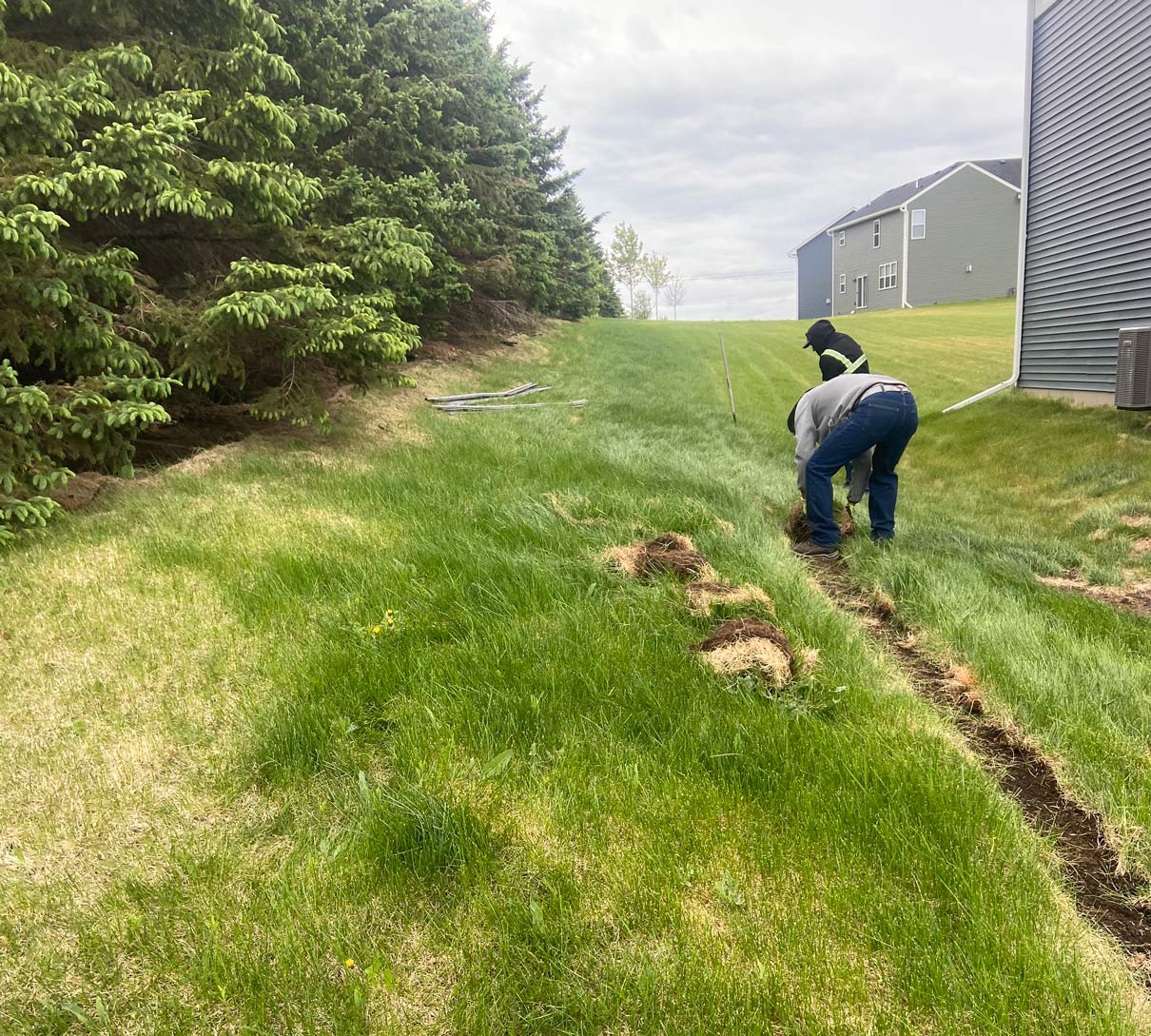 Lawn edging installation in progress at residential property in St. Paul